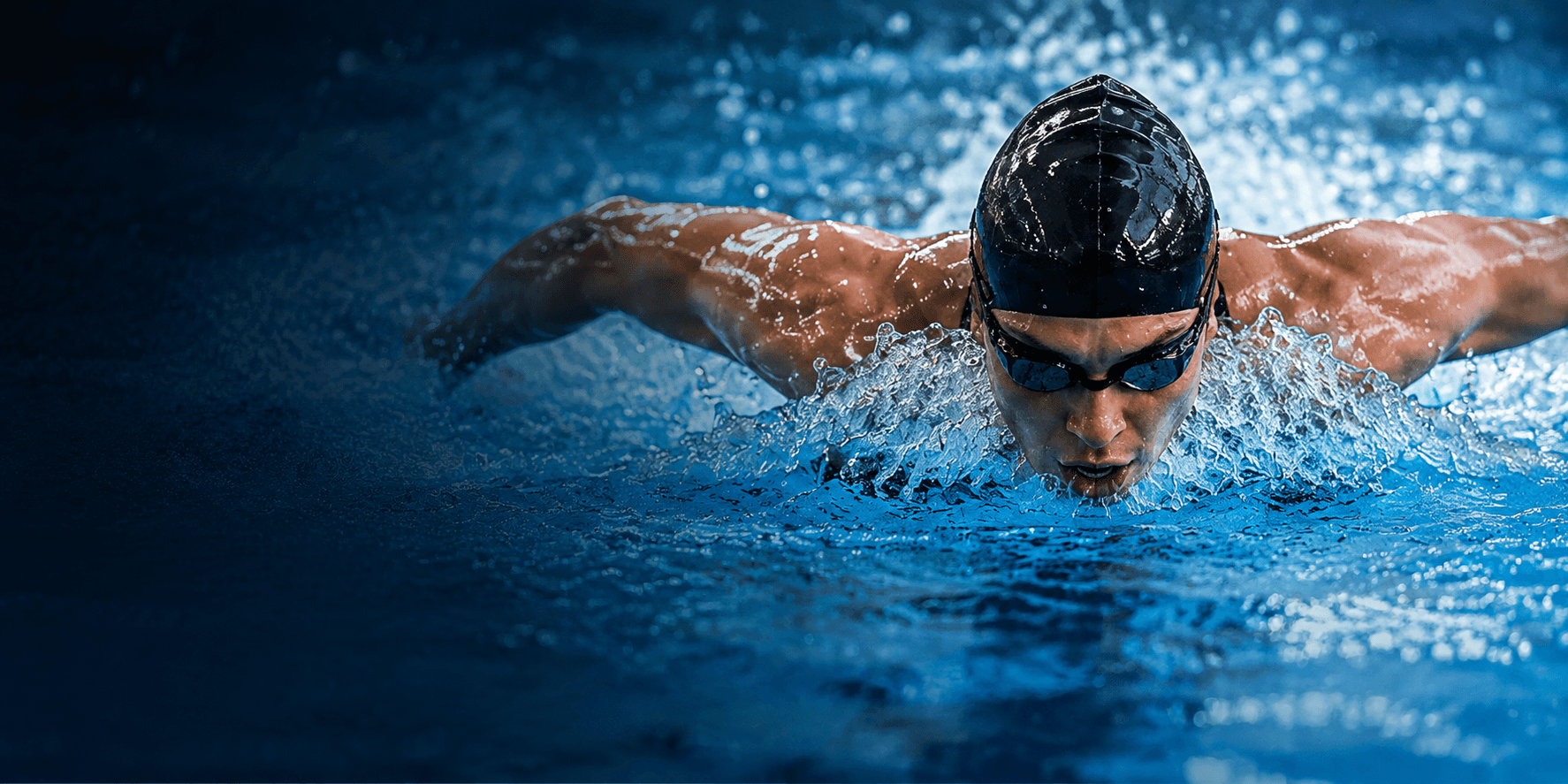 Swimmer powering through the water in a butterfly stroke